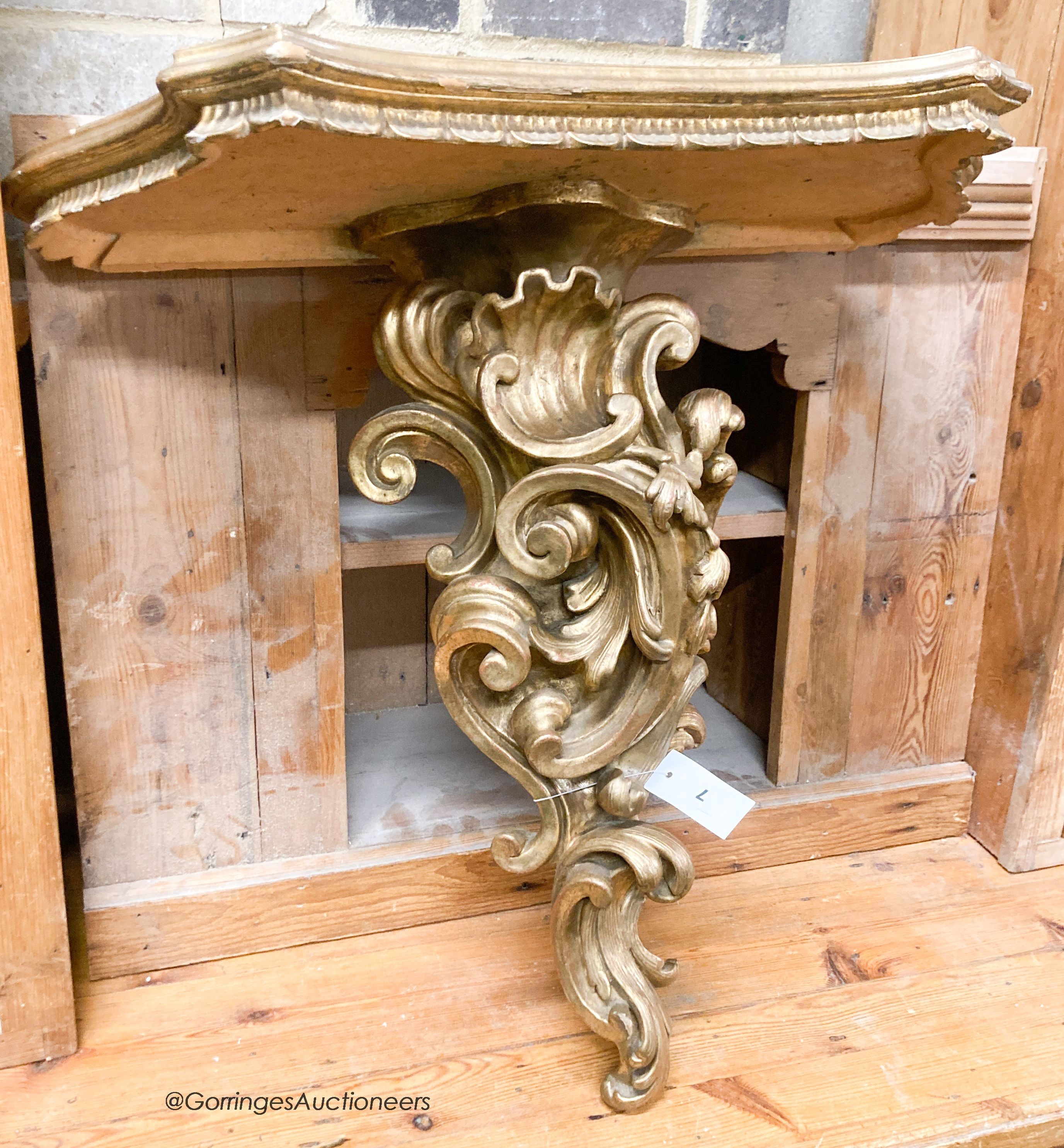 An Italian carved pine gilt console table, width 66cm, depth 38cm, height 67cm